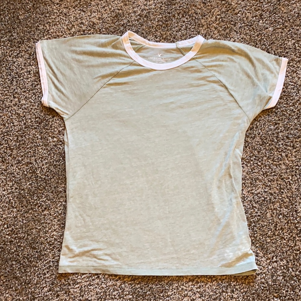 Loose-fit green too with white edging